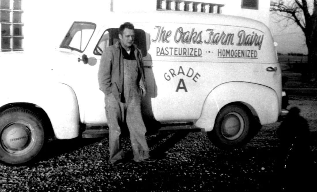 Nelson Meilahn, Derrick Grahn's grandfather, posing with one of his dairy delivery trucks, circa 1940.